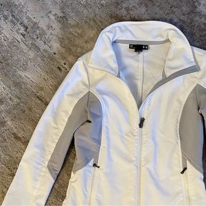 Under Amour womens XS  sports jacket with reversible cuffs and high neck zipper.